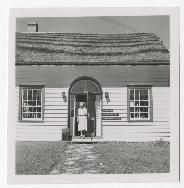 Ethel Renouf in the doorway of the Black Whale Shop